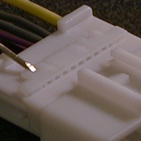 Retention latch on factory harness plug